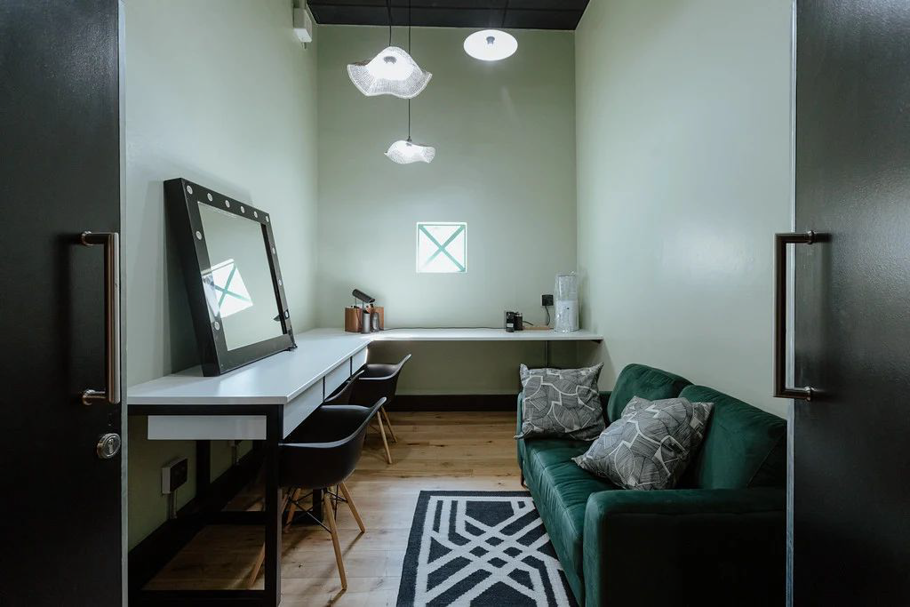 Backstage dressing room with mirror and sofa