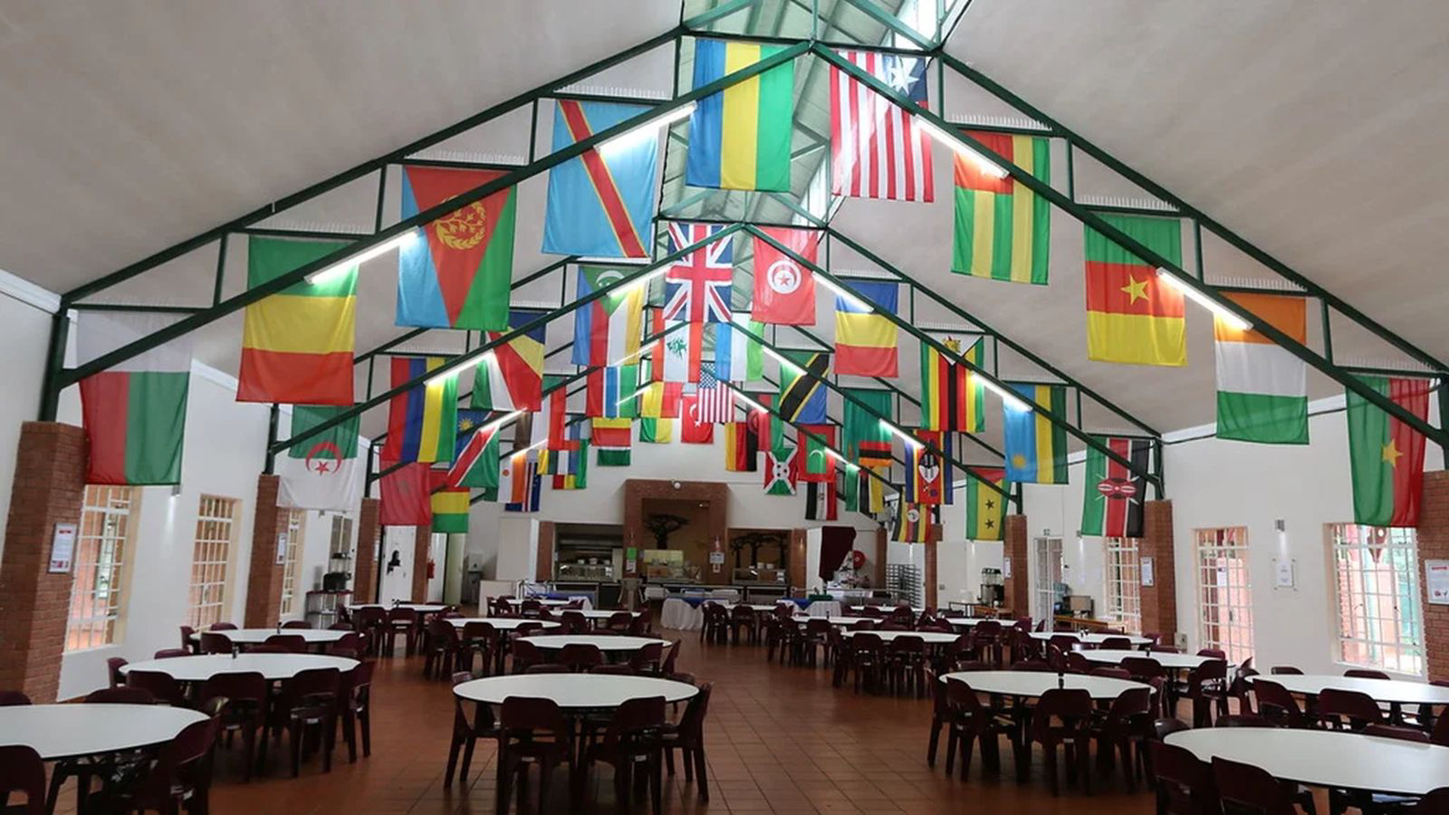 Dining hall with flags hanging from the ceiling